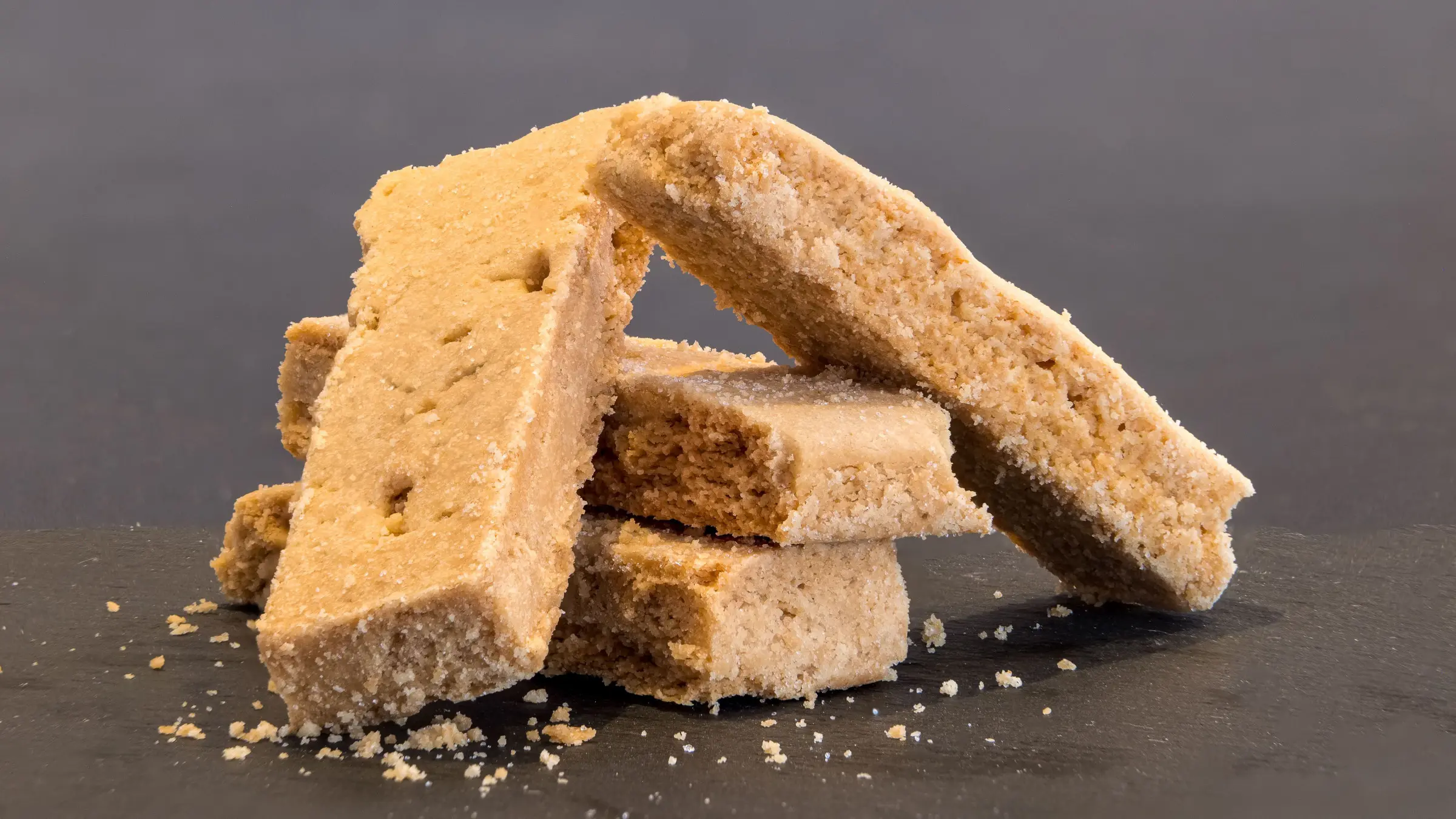 A close-up of four Scottish shortbread cookies.