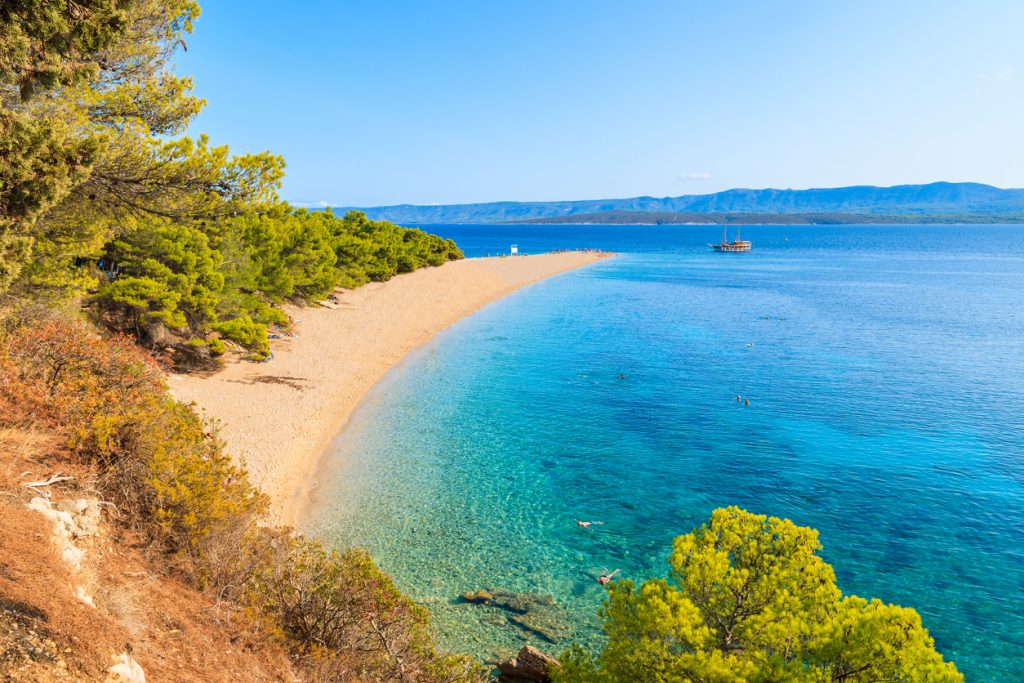 View of famous Zlatni Rat beach with beautiful sea water in Bol town, Brac island, Croatia