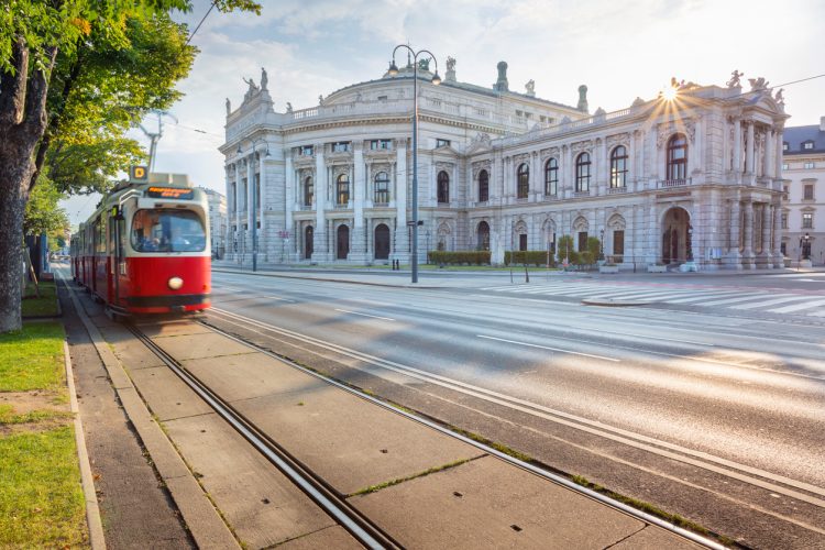 Cityscape image of Vienna with the Burgtheater and the Ring Road during sunrise