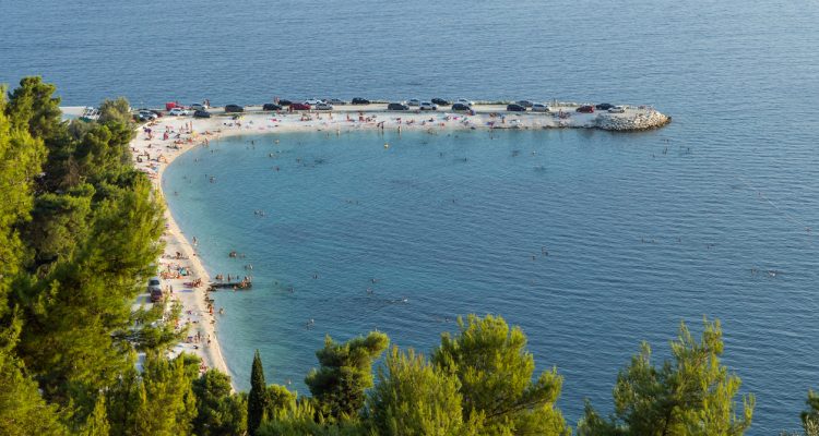 Popular beach at the Marjan peninsula in Split, Croatia, viewed from above.