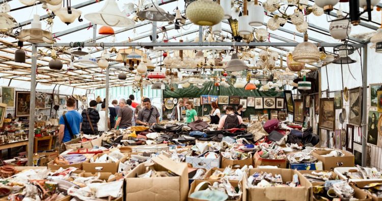 "Berlin, Germany - June 10, 2012: Tourists and locals browse through various used merchandise at Berlin's famous Mauerpark Sunday flea Market."