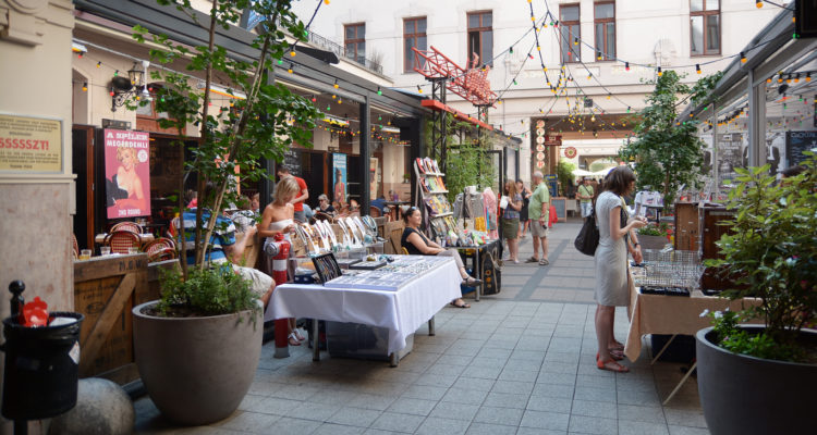 Budapest, Hungary - July 12, 2015: People shopping at Gozsdu Udvar pedestrian gallery in Budapest, small flea market area.