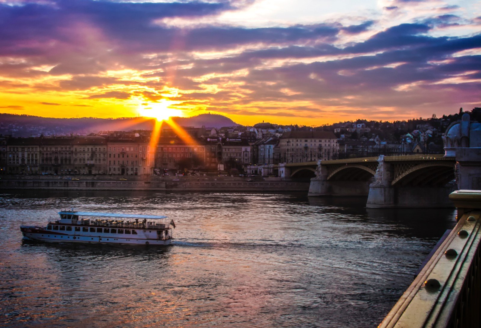 Sunset in Budapest, looking towards the Buda side hills from the banks of the Danube on the Pest side.