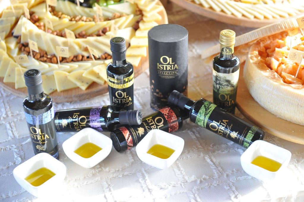 Bottles of OL Istria Croatian Olive Oil from Croatia's Istrian Peninsula, arranged for a tasting.