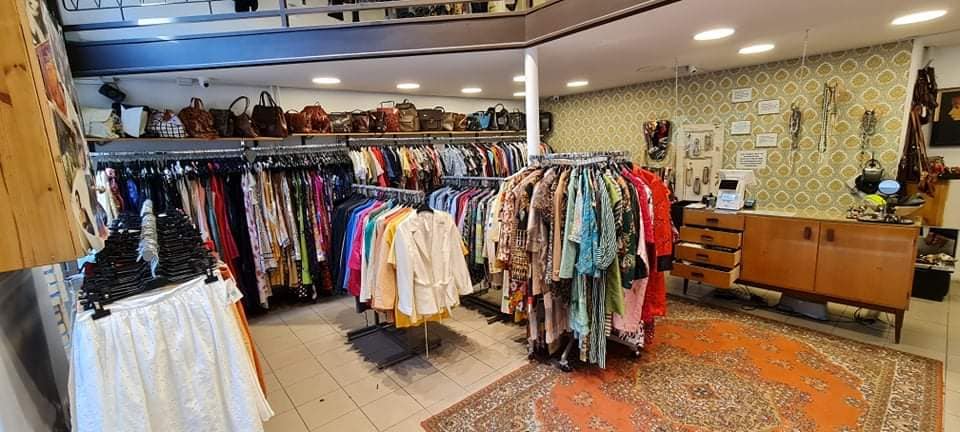 Racks of clothes at Humana Vintage Butik in Budapest
