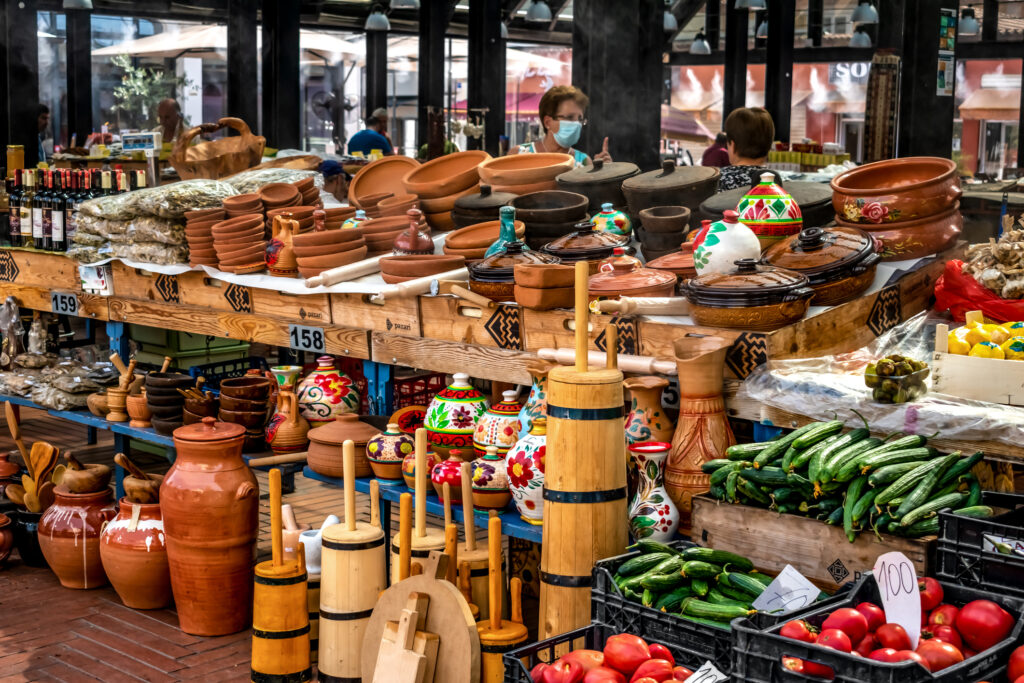 Handmade wooden and earthenware at the Pazari i Ri market in Tirana. A tourist souvenir stand at the new open-air market in the Albanian capital