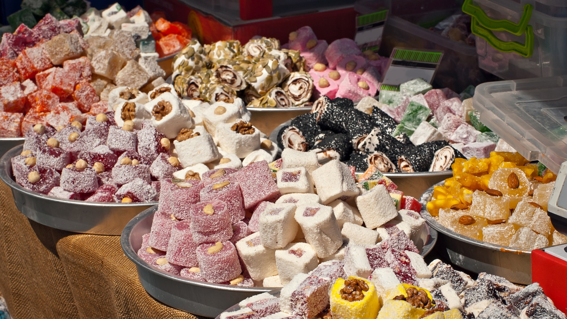 This image shows piles of various Turkish delight treats, in all colors and shapes.