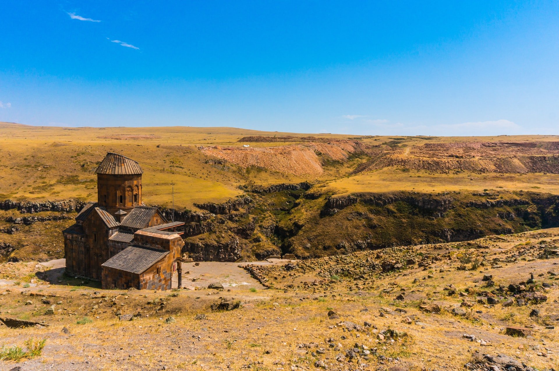 This image shows an ancient church set in a landscape of raw beauty.