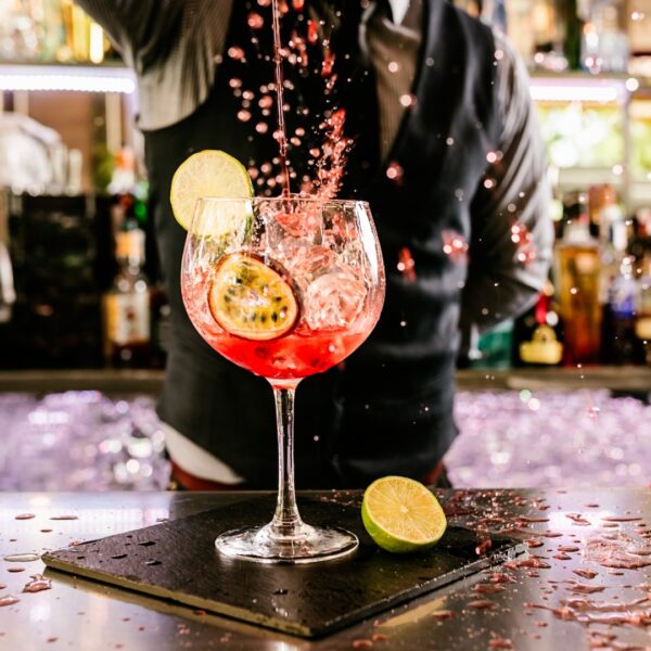 This image shows a bartender preparing a fancy-looking cocktail. It's the featured image of our Best Cocktail Bars in Istanbul article.