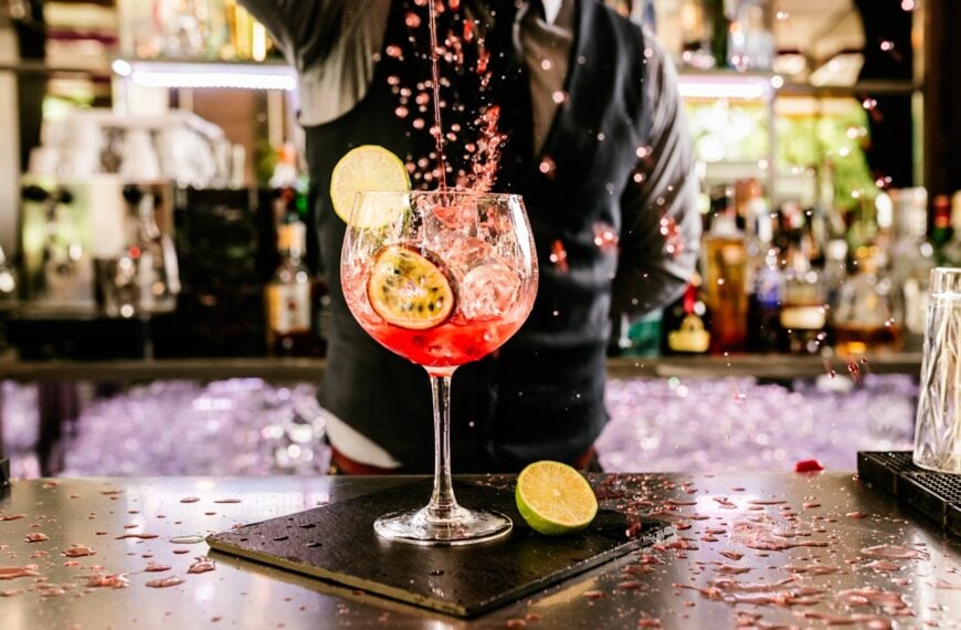 This image shows a bartender preparing a fancy-looking cocktail. It's the featured image of our Best Cocktail Bars in Istanbul article.