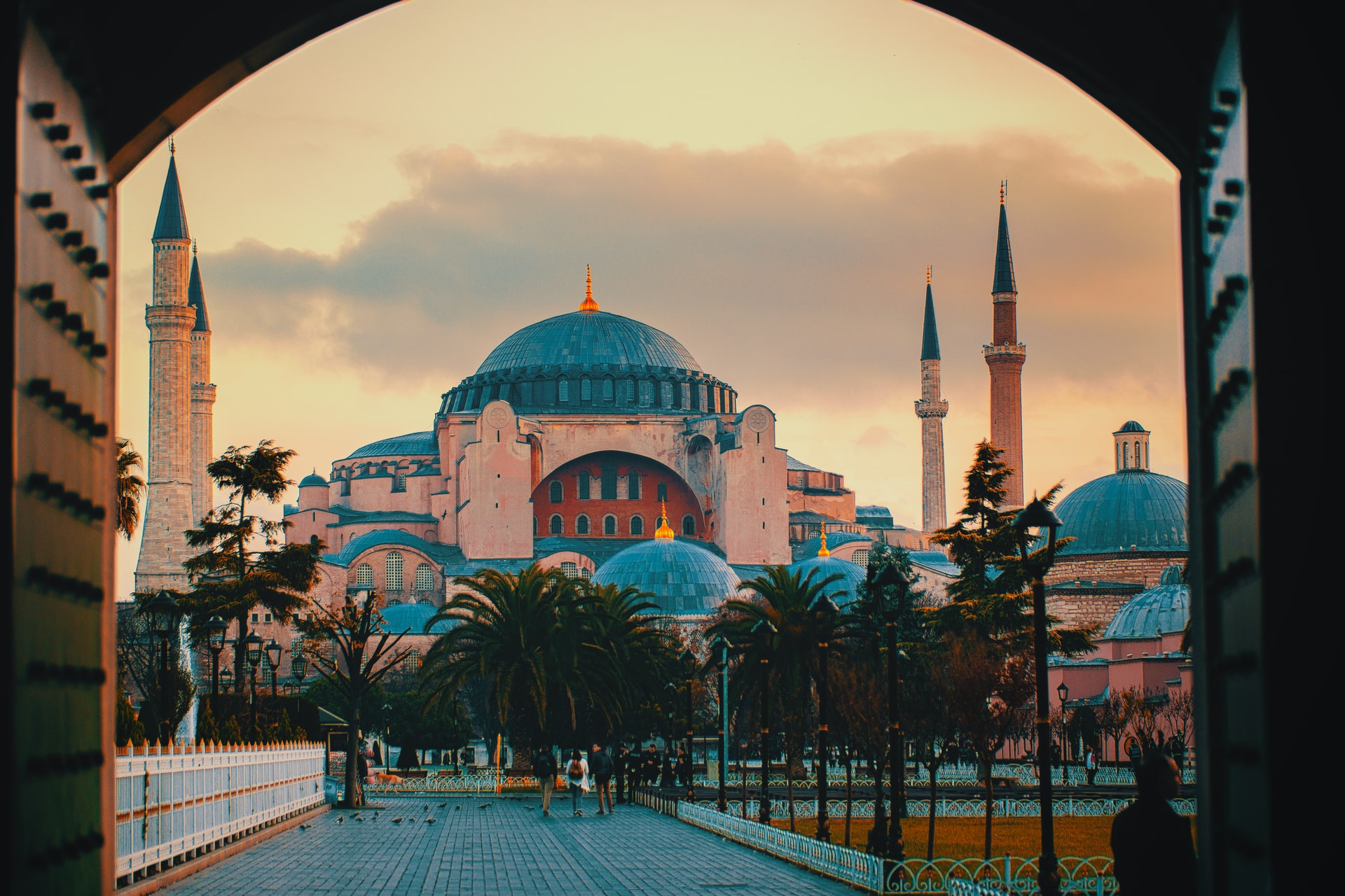 This image shows the Hagia Sophia in Istanbul, probably the most famous historic site in Turkey, with its pink hued walls and tall minarets.