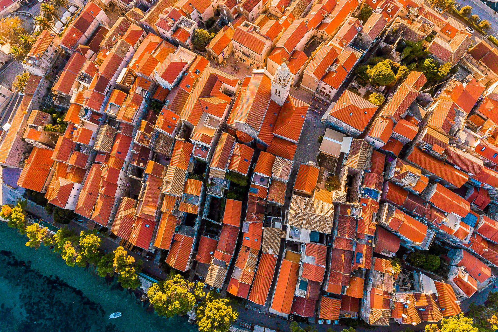 This is a top-down drone shot of Korcula with its picturesque red rooftops. 