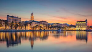 This is a panoramic view of Split under the warm sunrise colors. There's a perfect reflection of the buildings on the calm sea waters. Split should always be part of the best Croatia itineraries.