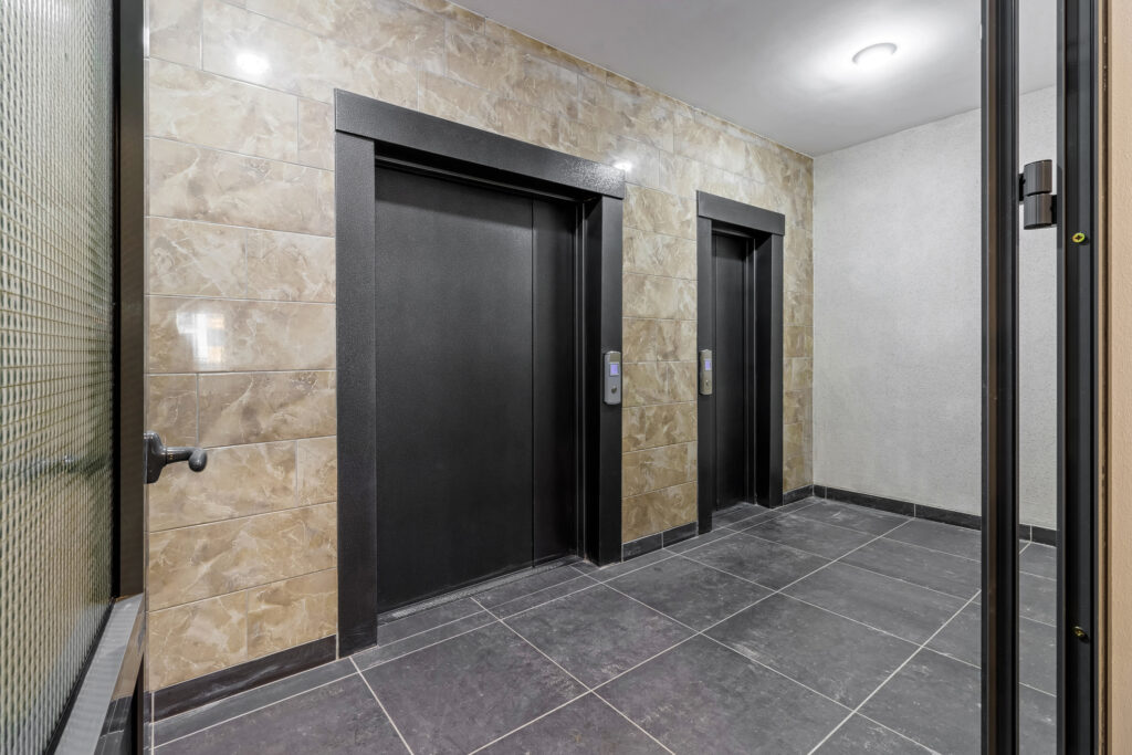 Large and small elevator doors side by side.
