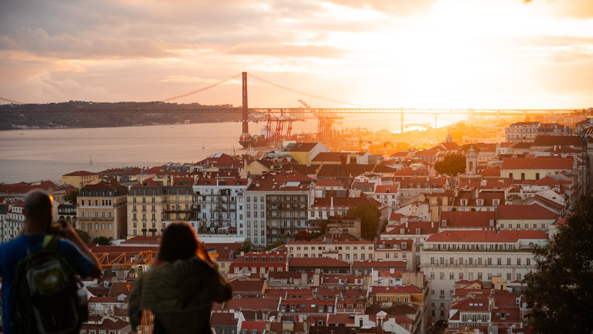 This image shows a panoramic view of Lisbon at sunset. 