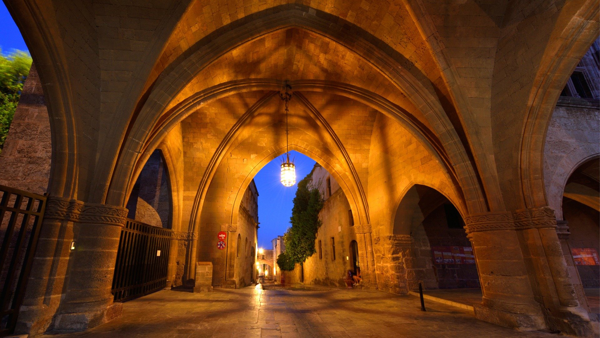 This image shows the dimly lit Knights Street in Rhodes Old Town. 