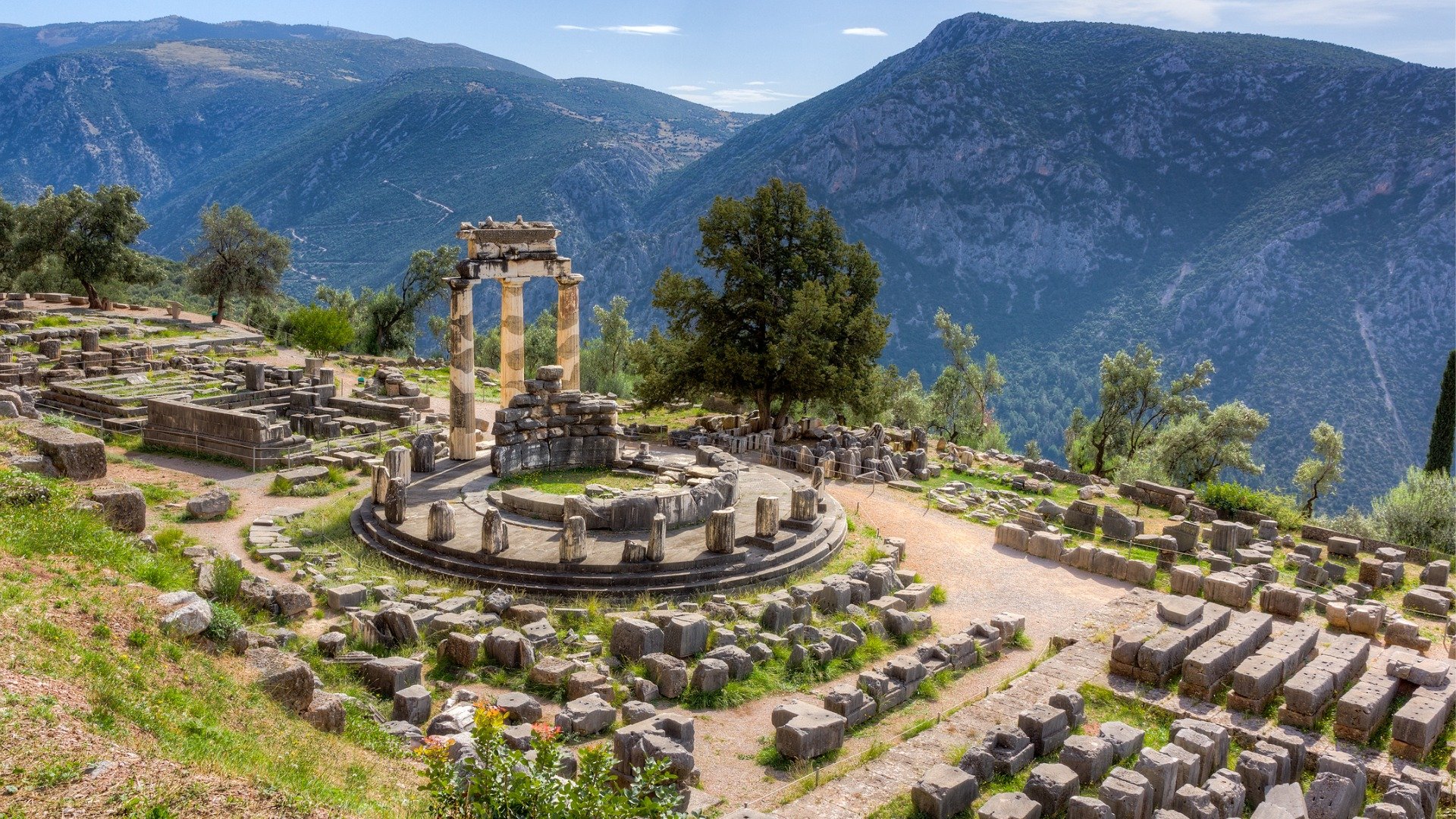 This image shows the Temple of Athena Pronaia in Delphi, one of the best places to visit in mainland Greece. 