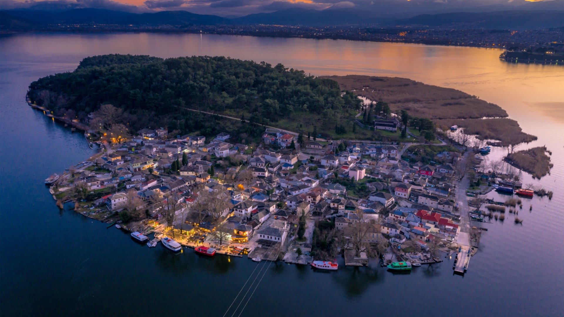 An aerial view of the Ioannina lake island at dusk. 