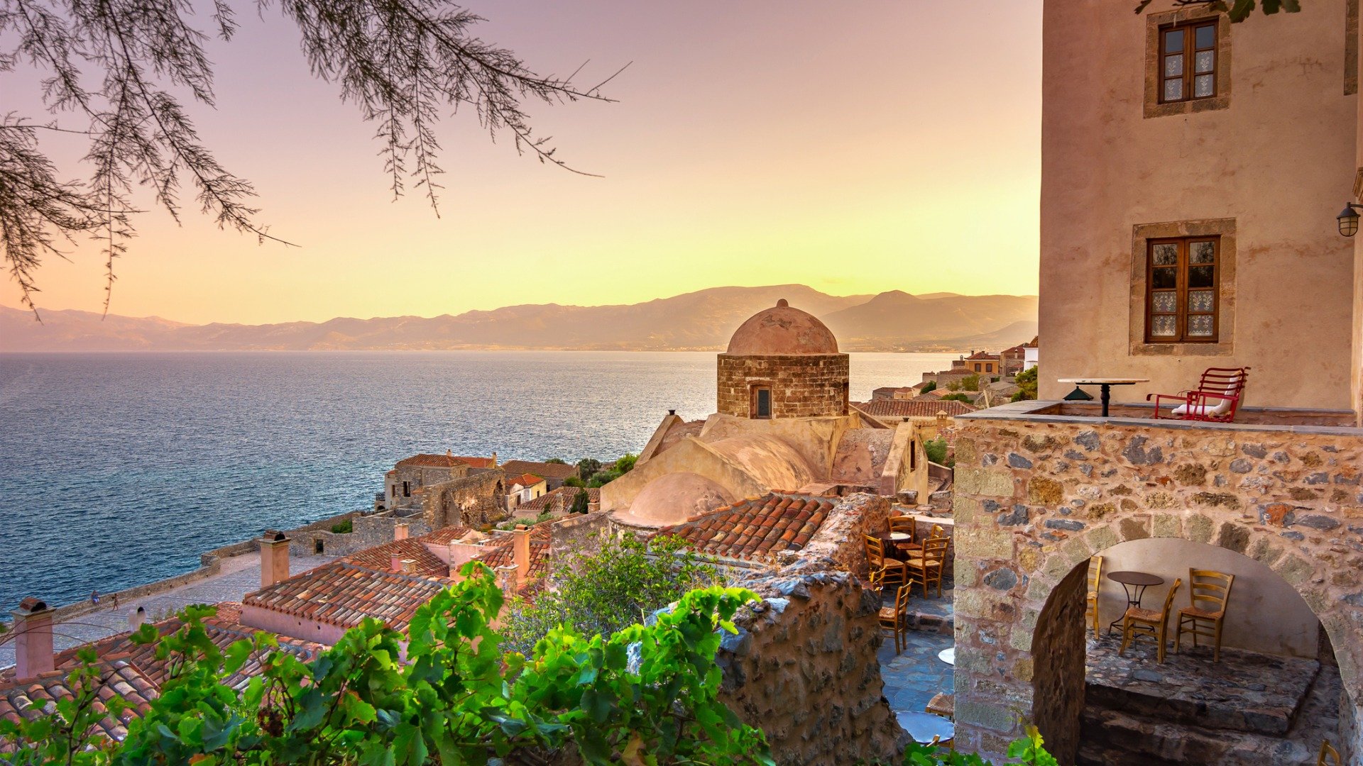 This is an image of the castle town of Monemvasia at sunset. 
