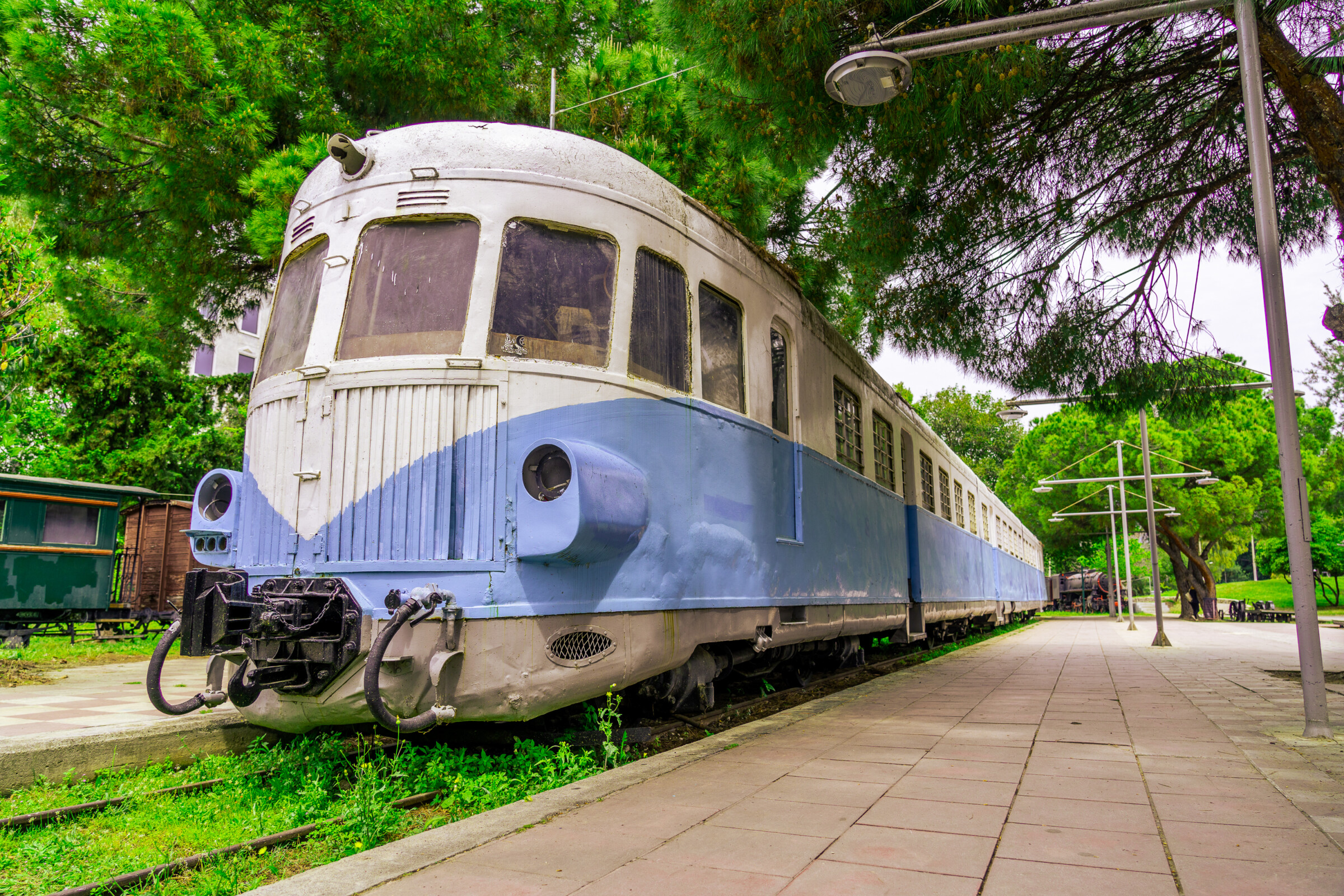 This is a close-up of a white and blue vintage train in a park in Kalamata, one of the lesser-known places to visit in mainland Greece. 