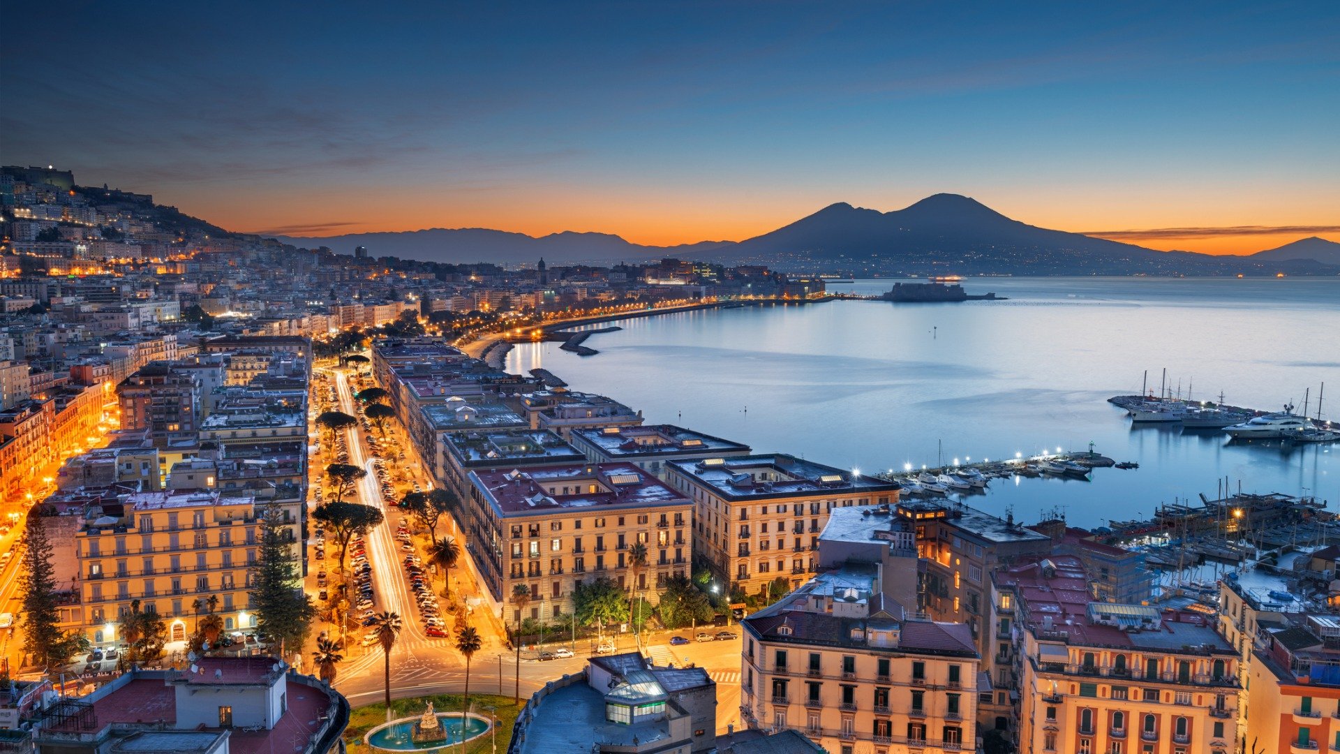 This is a panoramic view of the Bay of  Naples in the blue hour. 