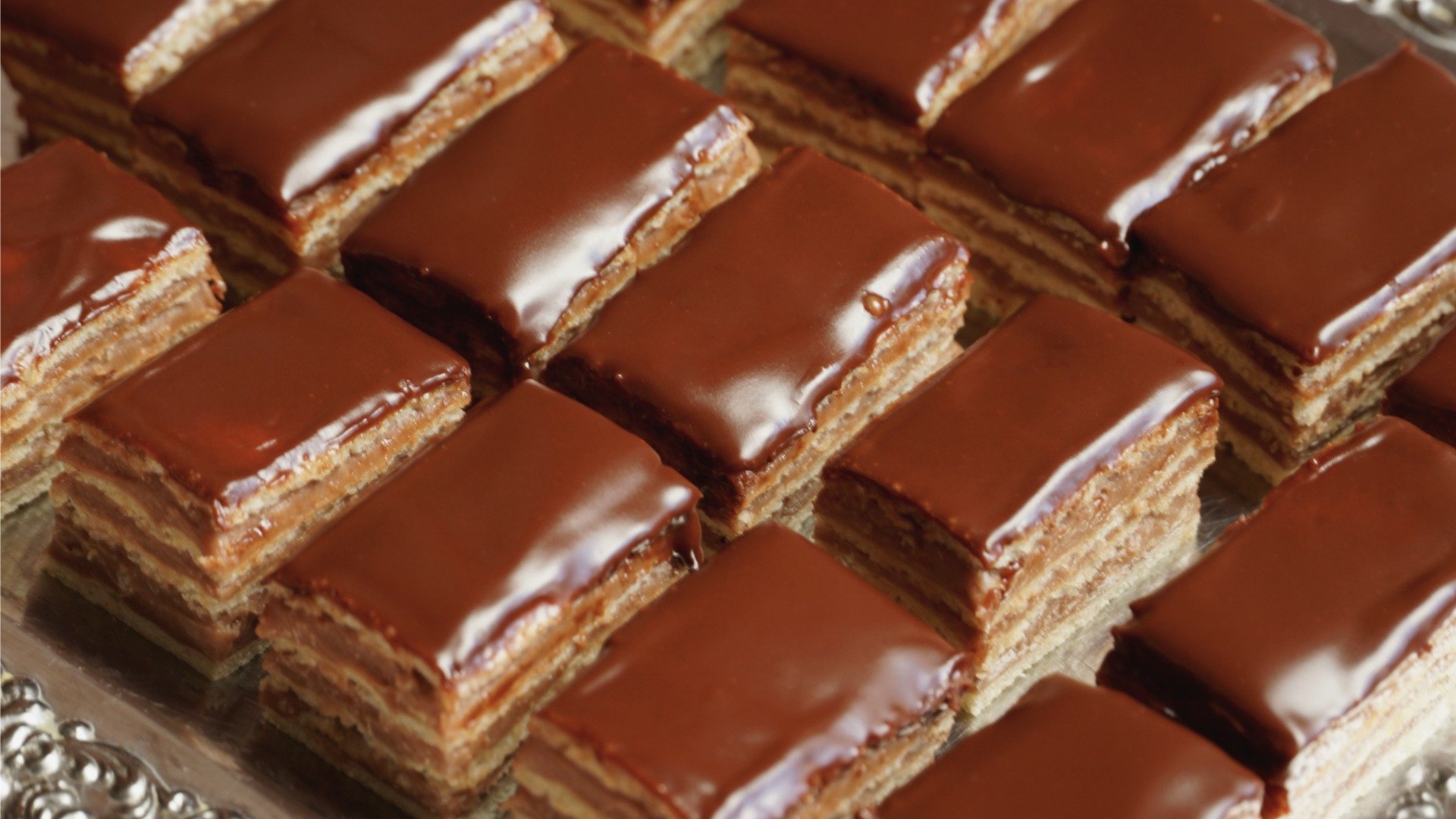 This is a close up of chocolate-covered Madarica rectangular pieces. 