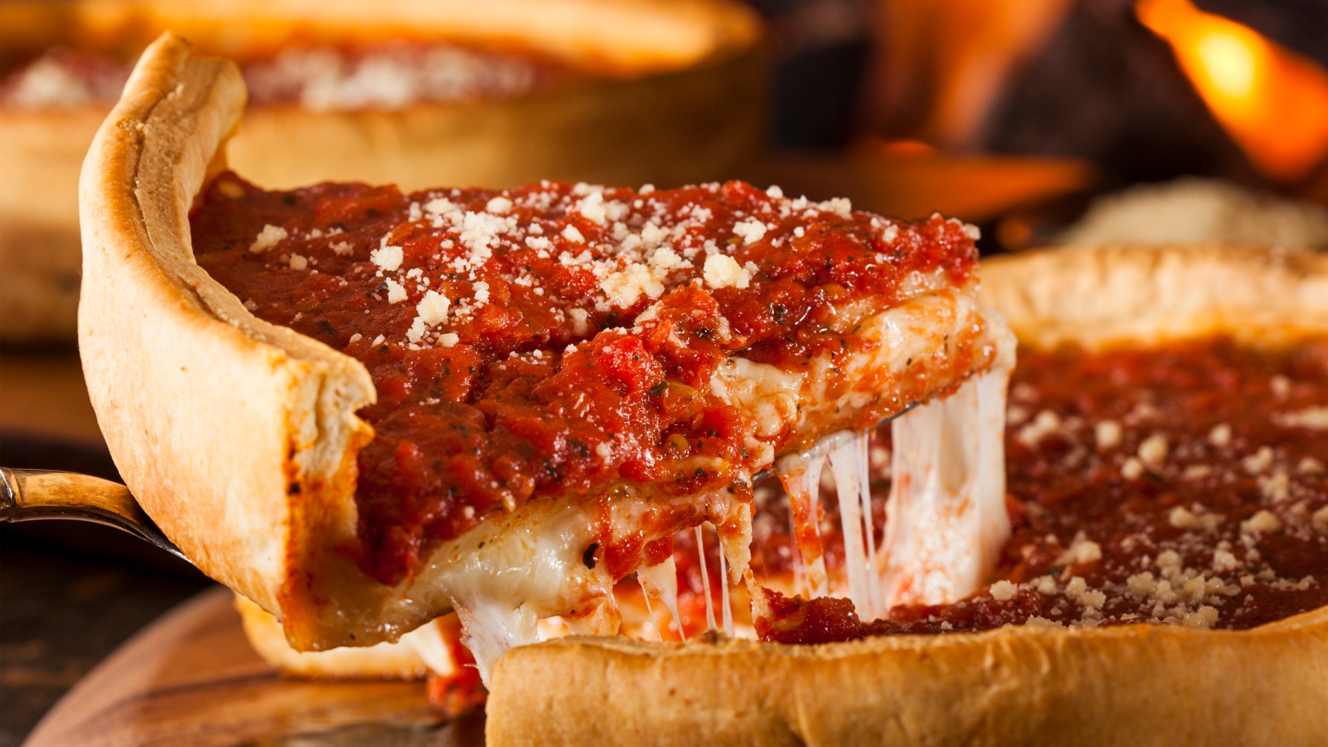 A close up of a Chicago-style deep dish pizza. 