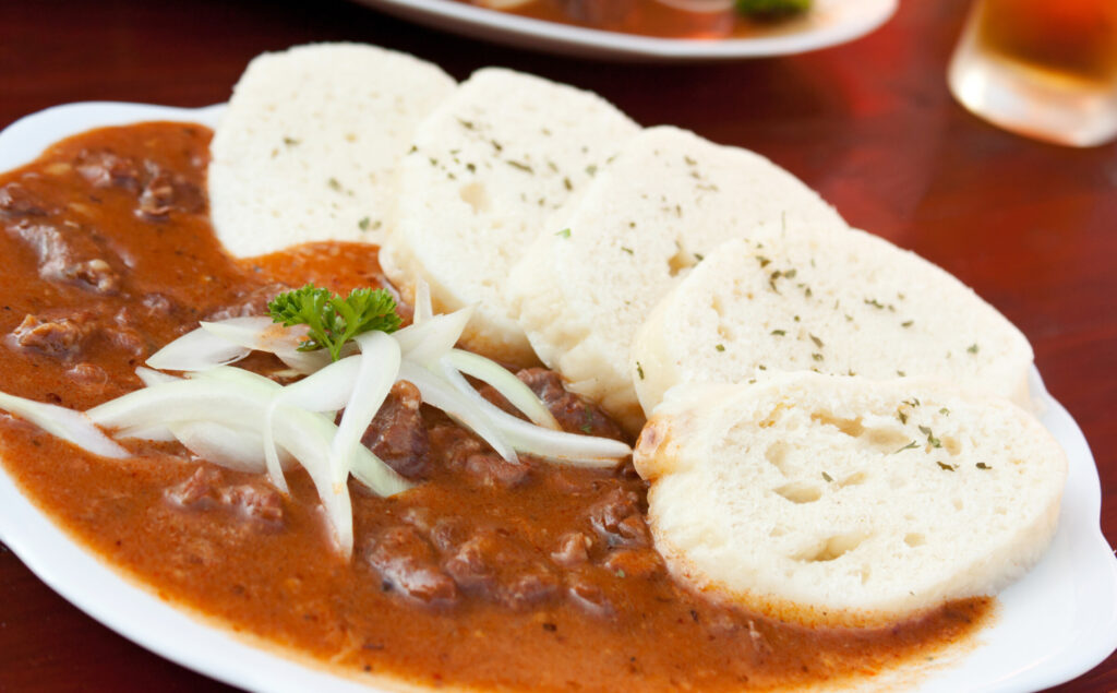 Beef goulash and bread dumplings (knedliky)