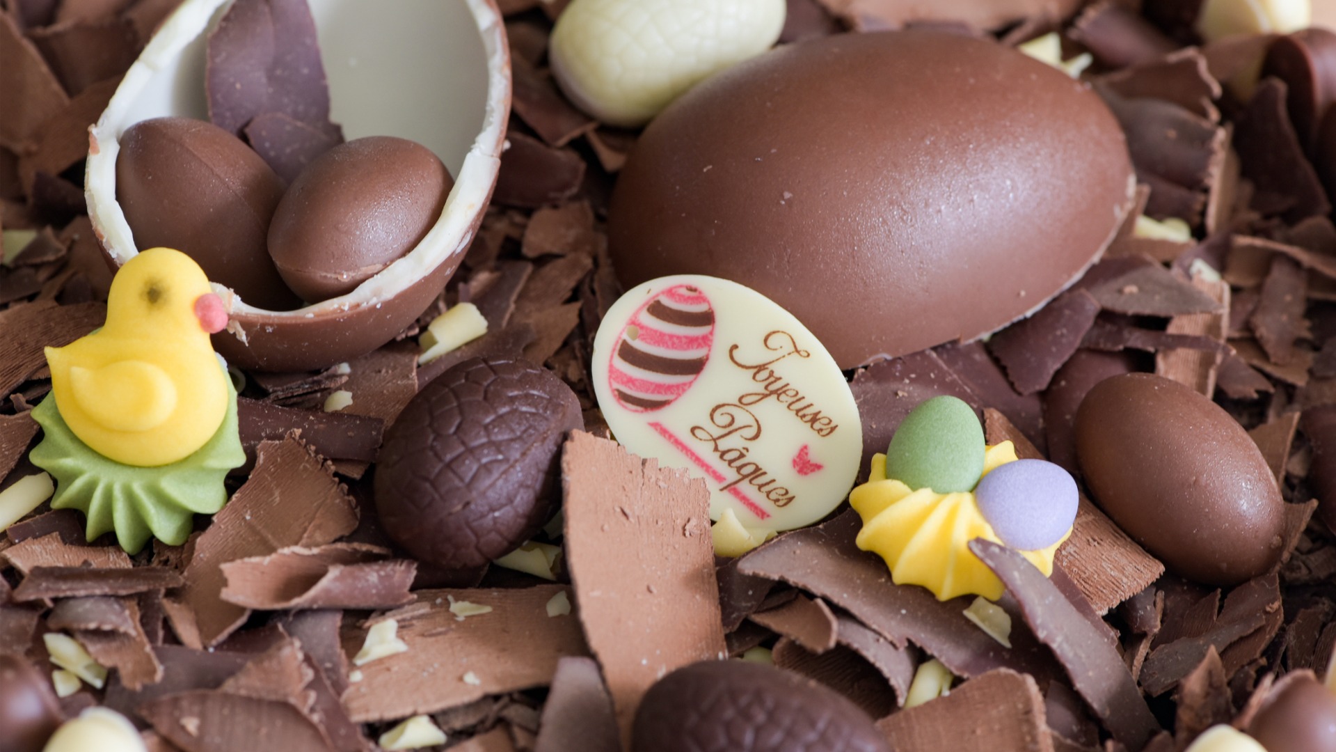 A close-up of several pieces of chocolate eggs. 