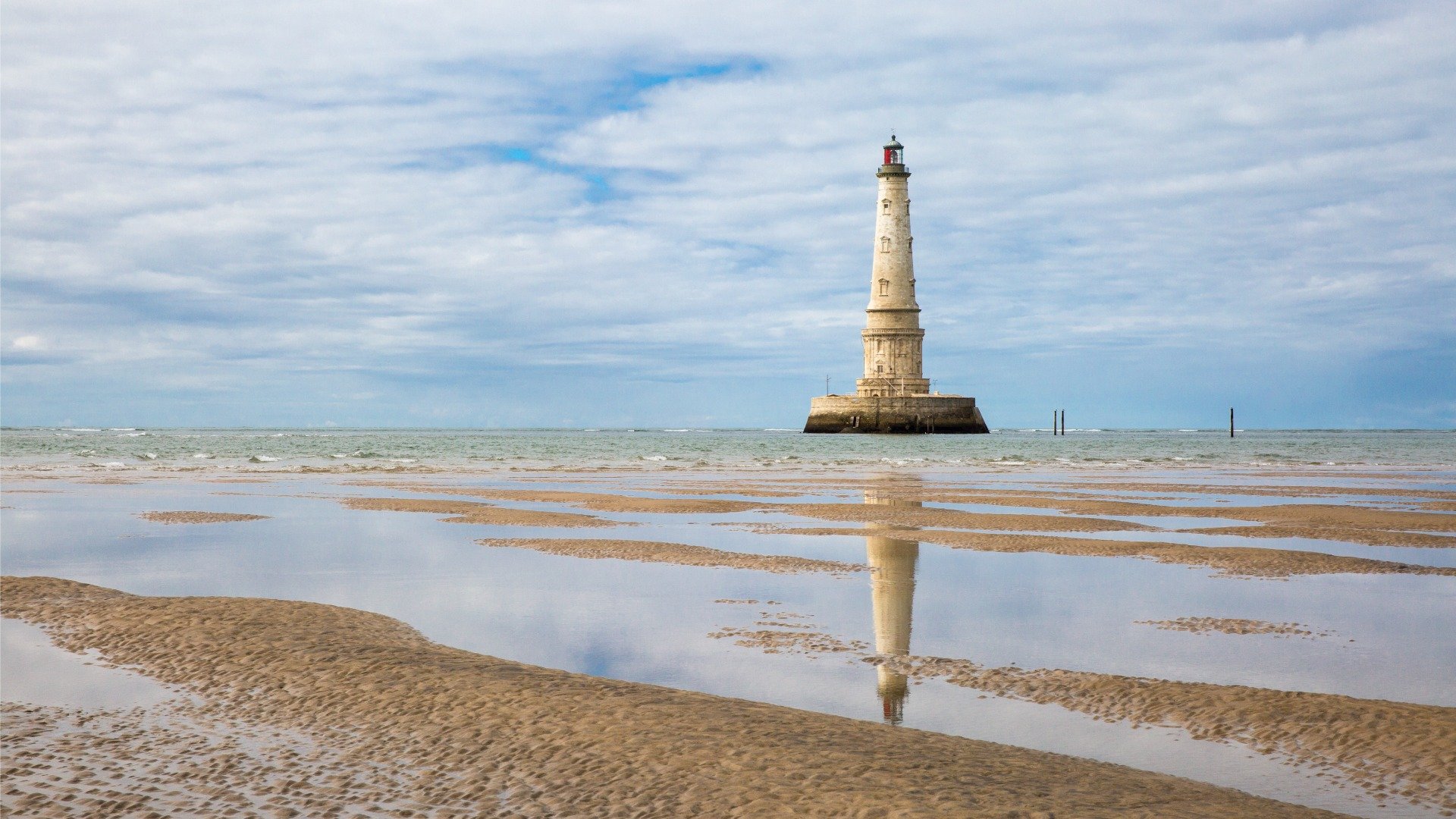 The elaborate Cordouan Lighthouse at low tide. 