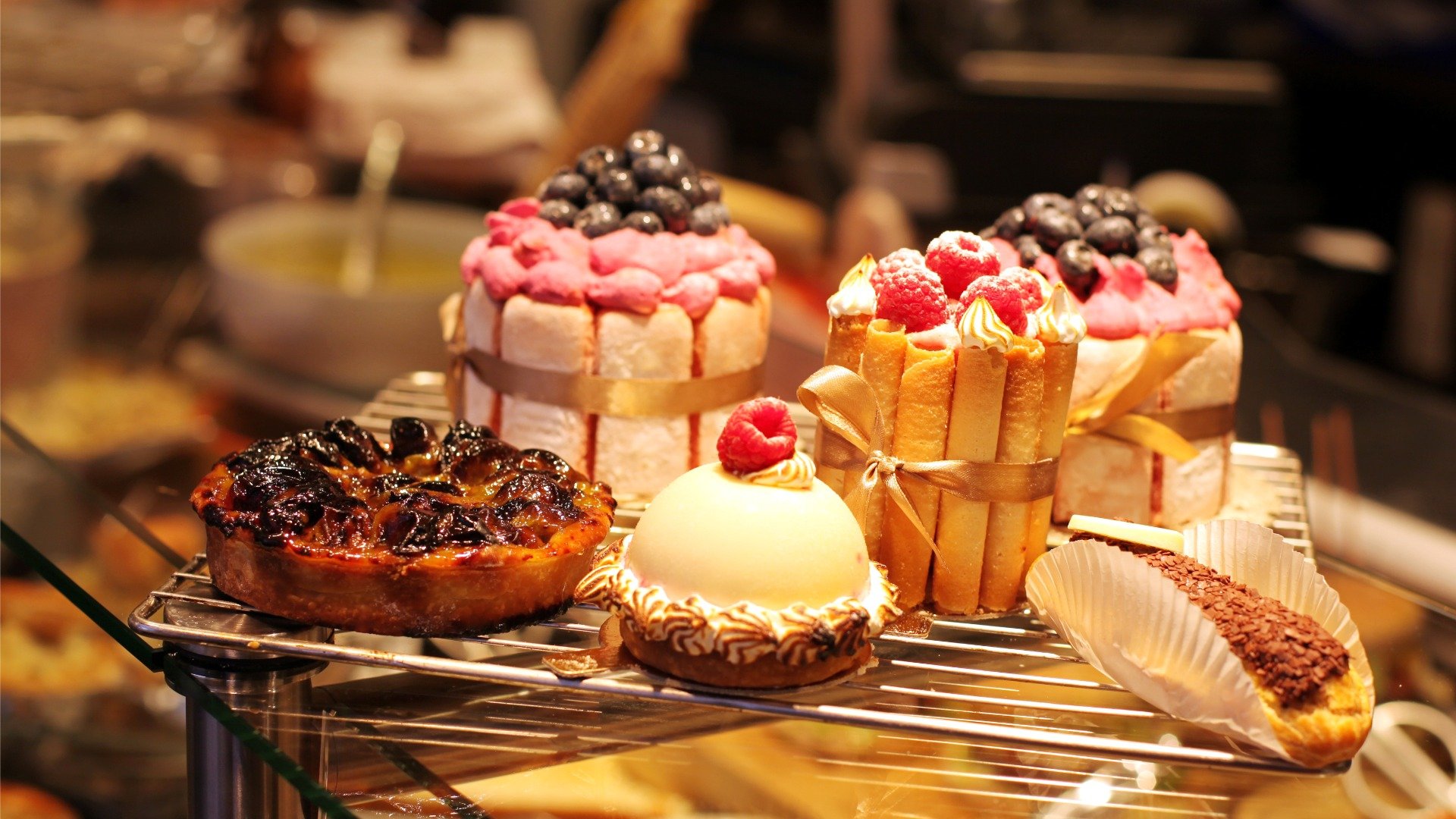 Six French pastries on a rack. 