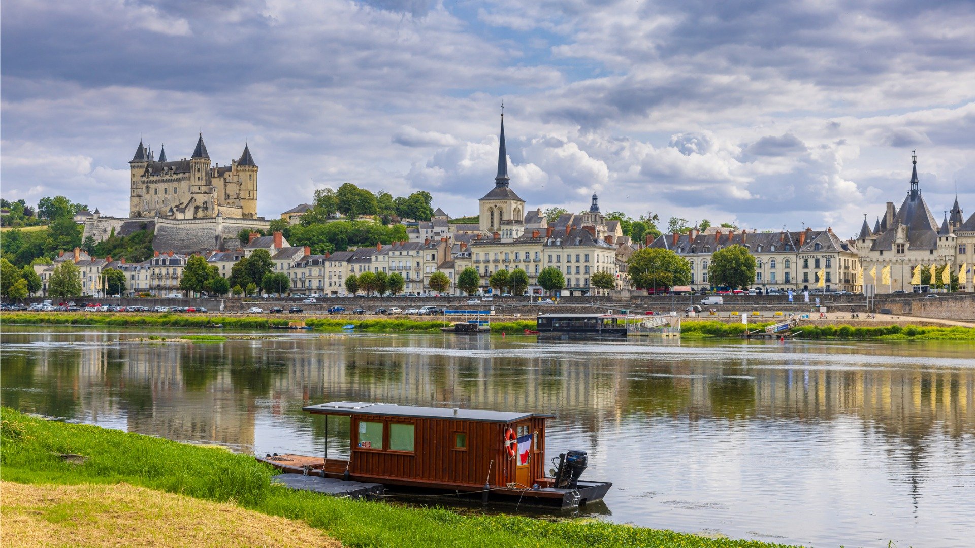 A beautiful town with castles and a river. 