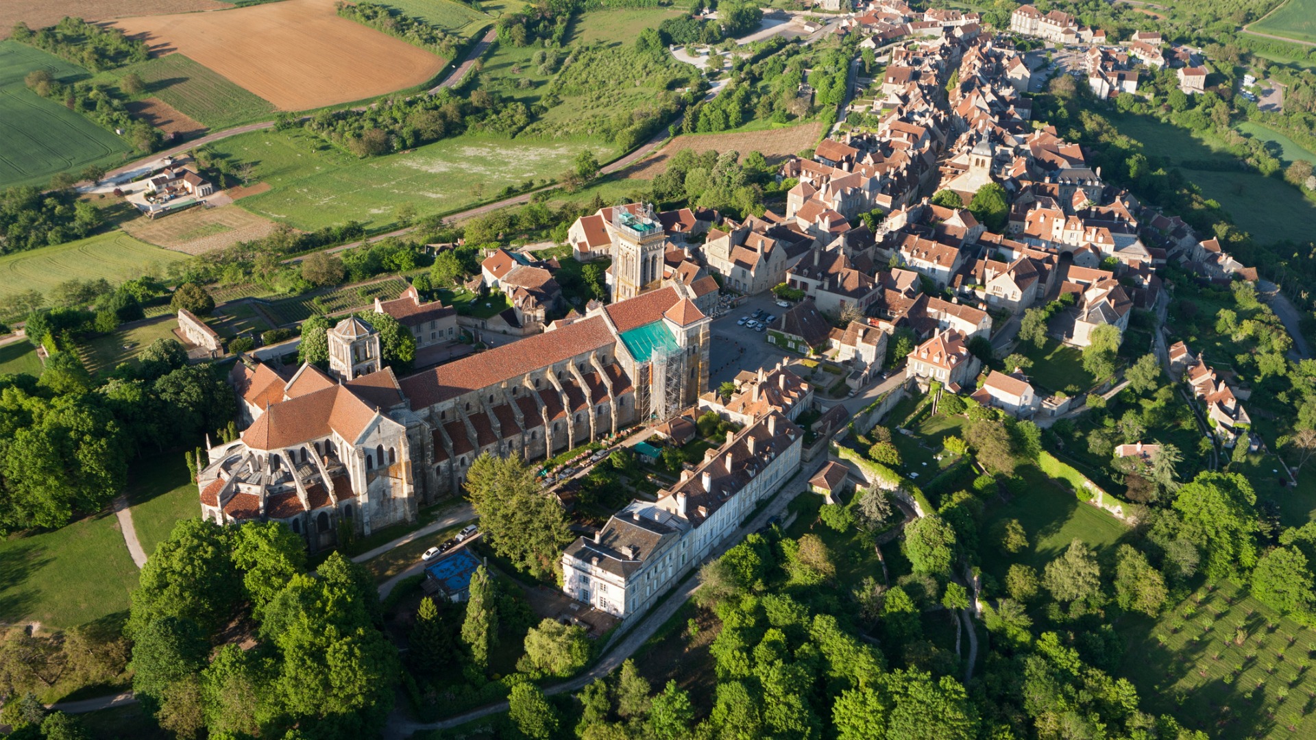 An aerial view of Vezelay Church & Hill, with the picturesque town in the background. 