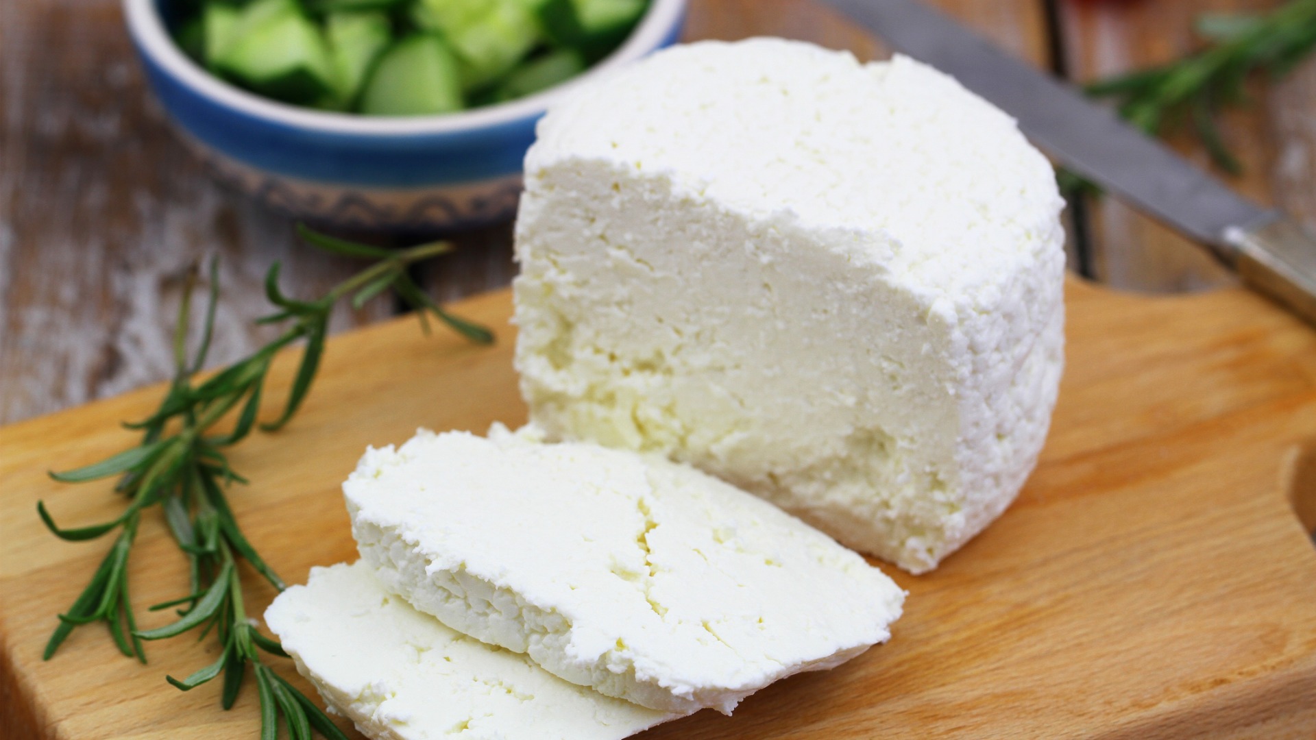 A soft white cheese cut in slices. 