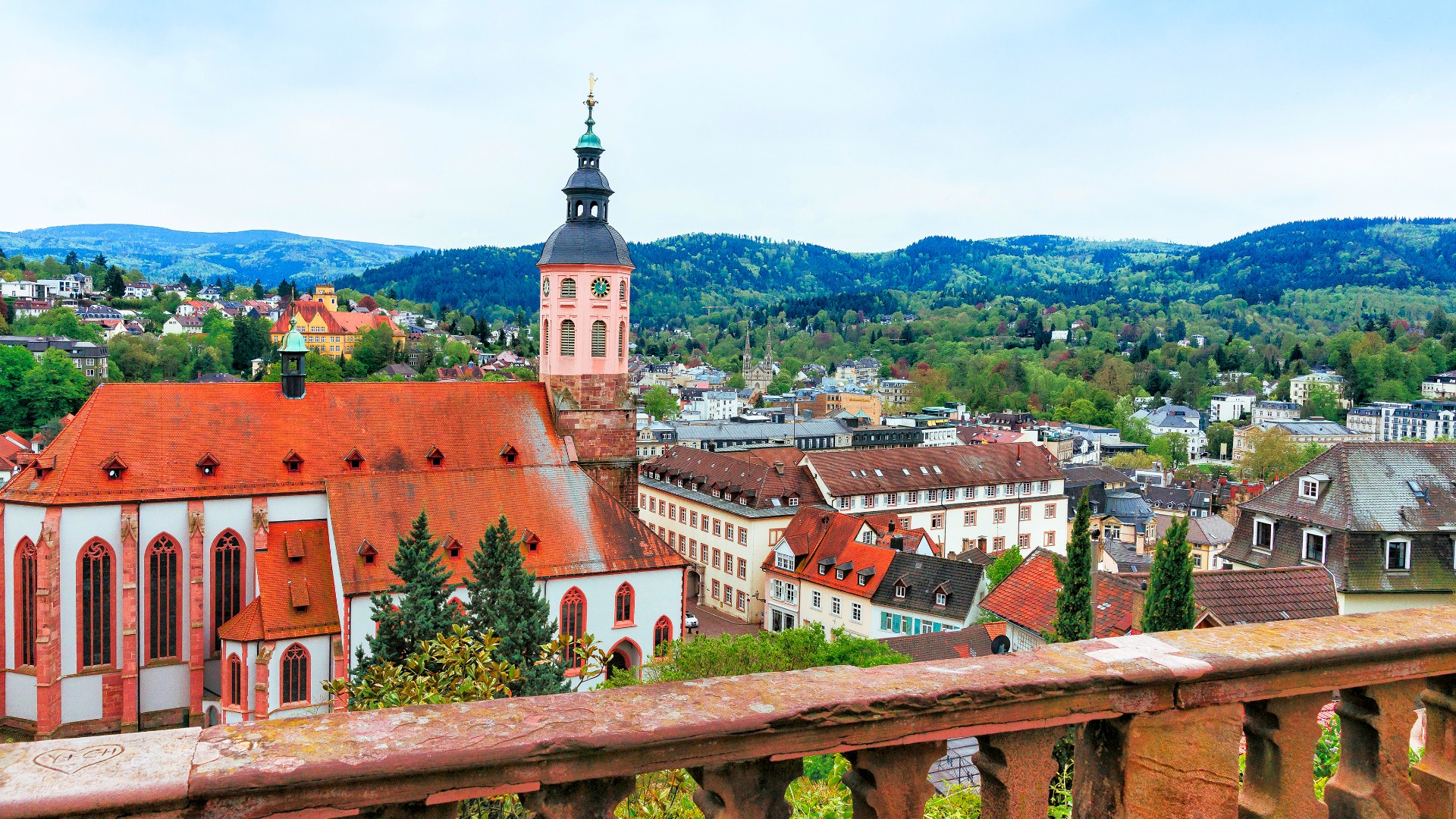 A panoramic view of Baden Baden with a big church in the foreground. 