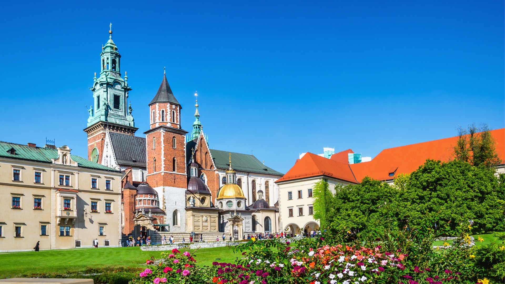 Krakow's Wawel Castle and Cathedral Square with flowers in the foreground. 