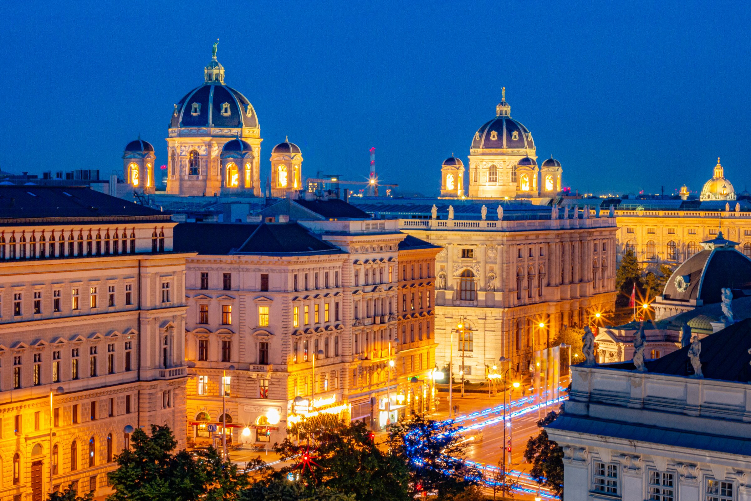 Beautifully lit magnificent architecture at dusk in Vienna, one of the best places to visit in Austria. 