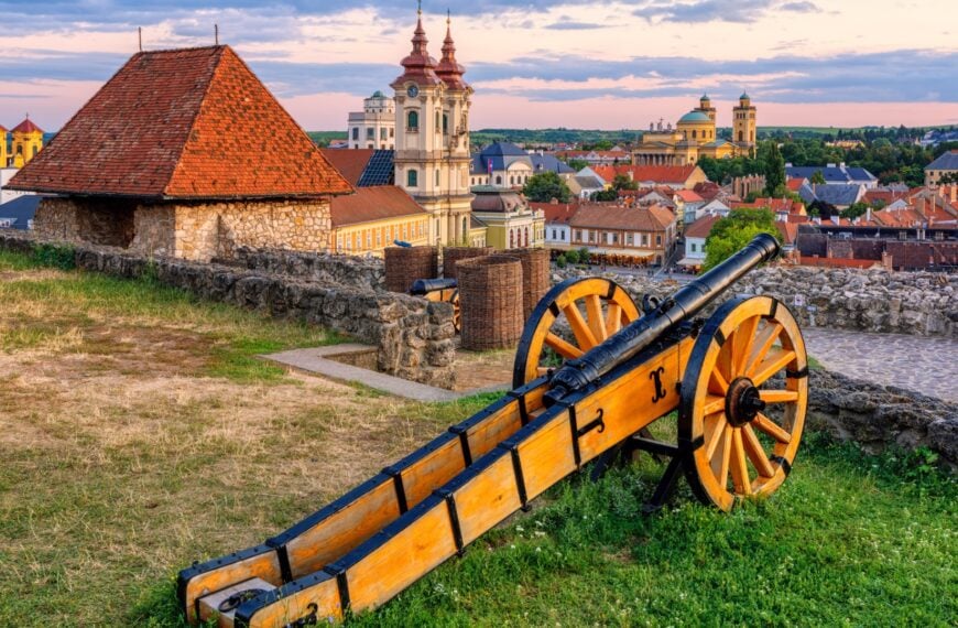 An old cannon overlooking the historic center of Eger in Hungary.