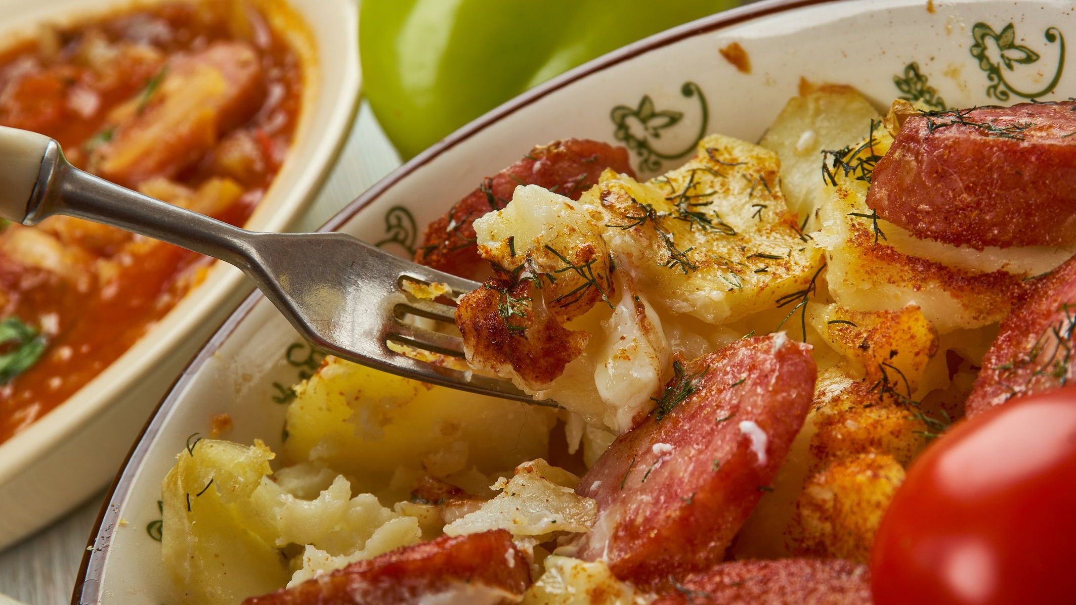 A casserole made of potatoes and sausages.