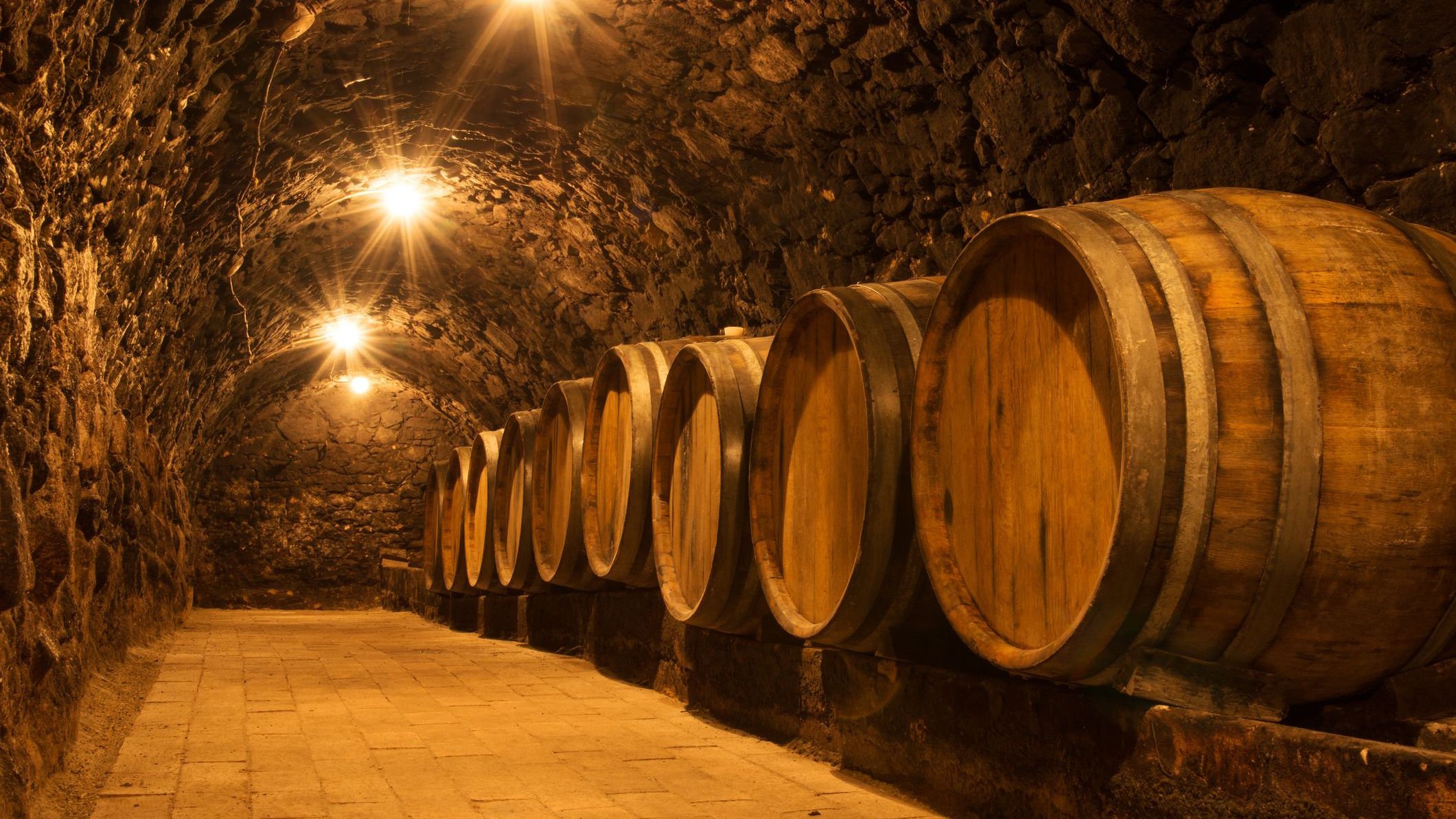 Oak barrels in the tunnel of a Tokaj winery cellar.