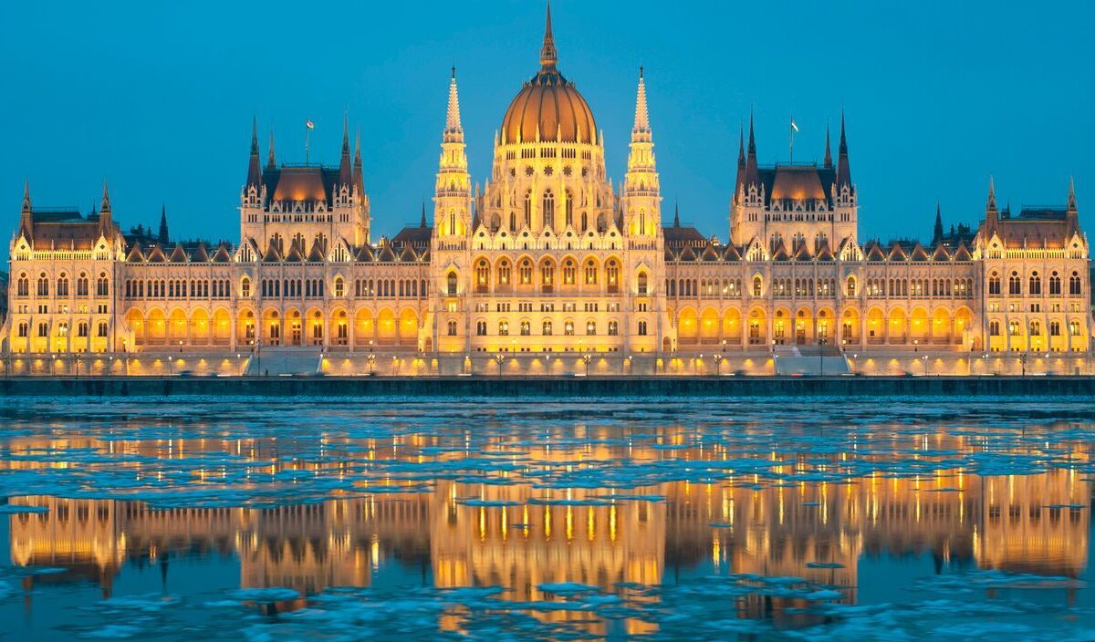 The Hungarian Parliament Building and its reflection on the icy water of the Danube River.