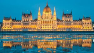 The Hungarian Parliament Building and its reflection on the icy water of the Danube River.