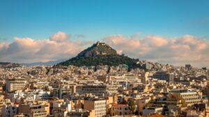 A panoramic view of the modern side of Athens with Lycabettus Hill dominating the skyline.