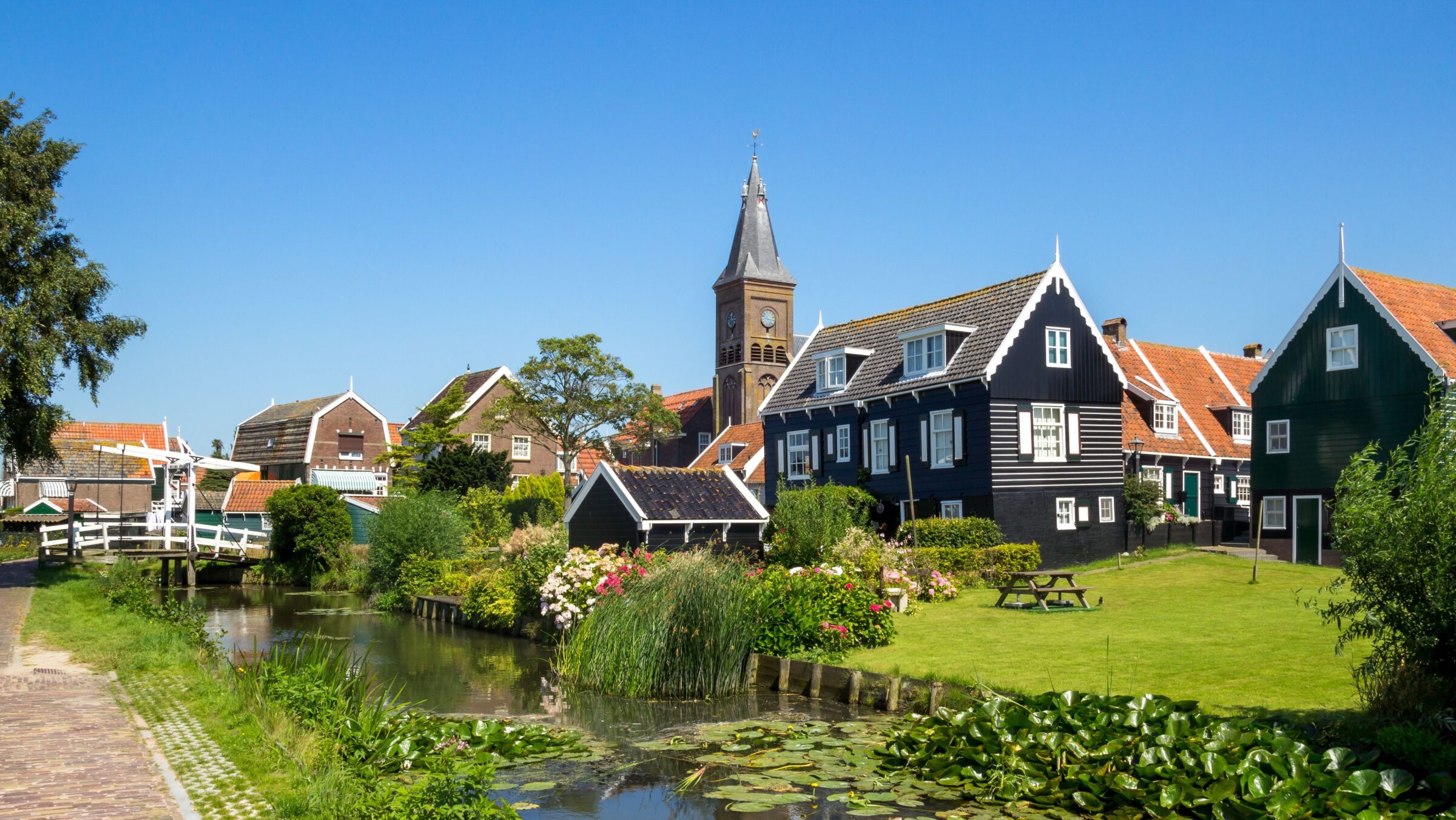 A quaint village with traditional buildings and canals.