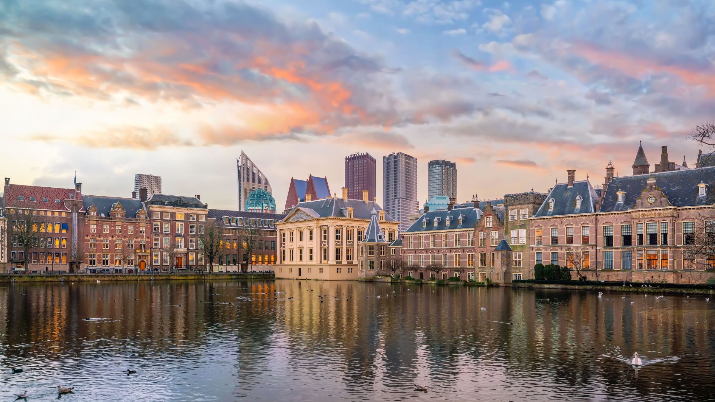 Cityscape of the Hague at sunset with the Binnenhof castle (Dutch Parliament).