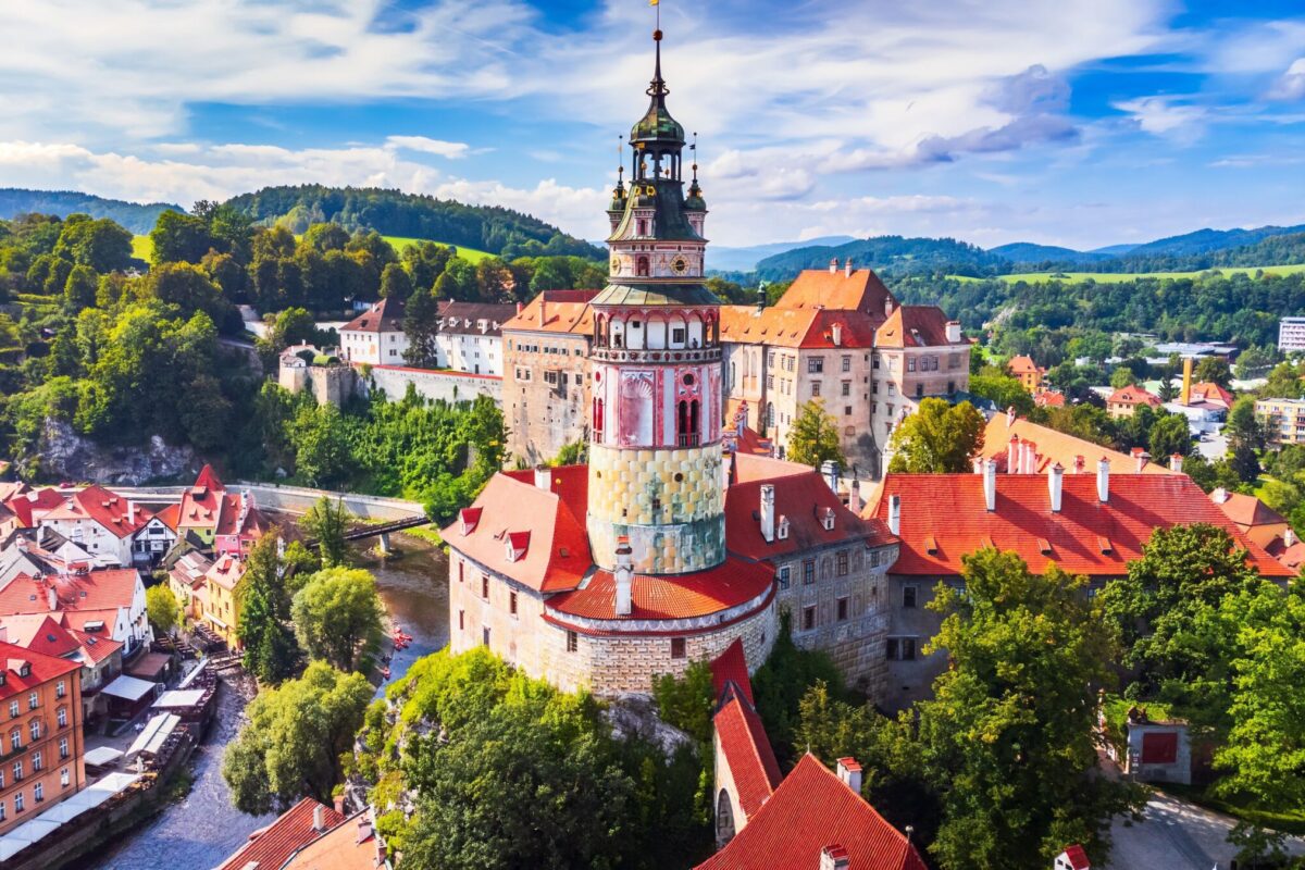 An aerial view over the historic center of Cesky Krumlov and the Vltava River.