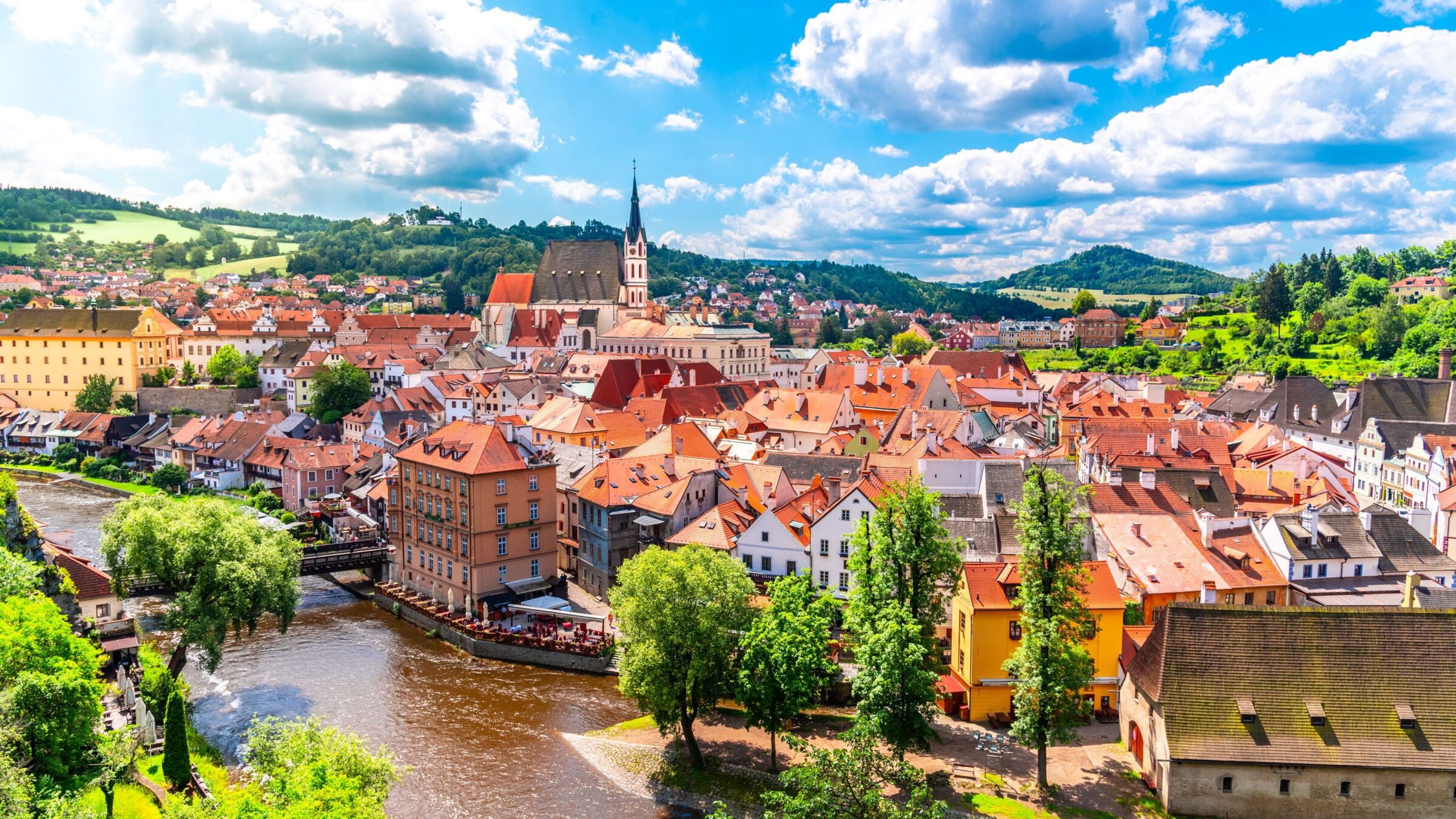 A panoramic view of Cesky Krumlov with St. Vitus church in the heart of the historic center.