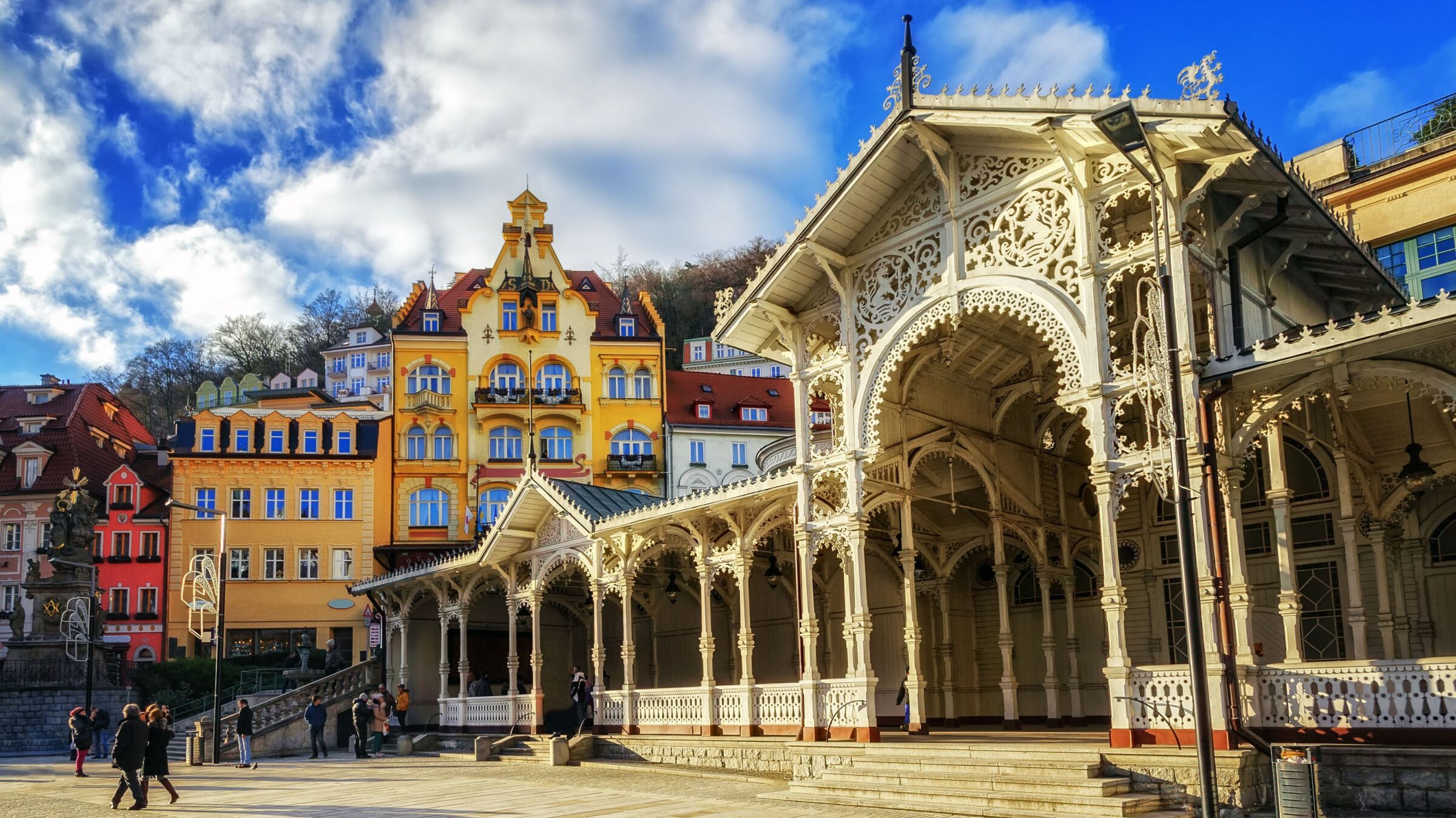 People walking in the historic center of Karlovy Vary, one of the best places to visit in the Czech Republic.