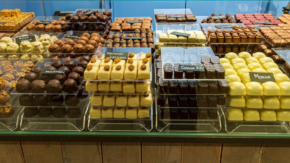 Various chocolates at a chocolatier's in Bruges, one of the best places to visit in Belgium.