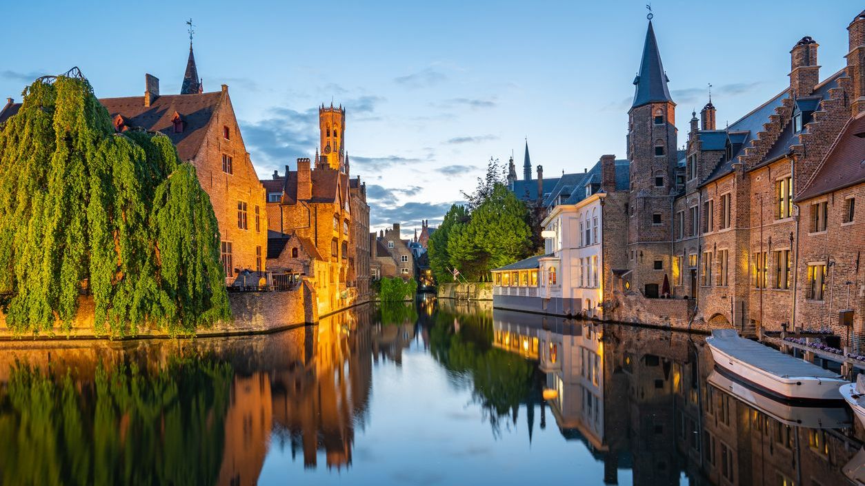 Bruges skyline with old buildings at twilight.